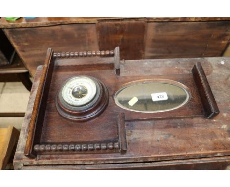 An oak and mirrored back hall barometer