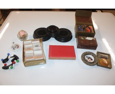 A box containing projector slide, wooden stand, playing cards etc.