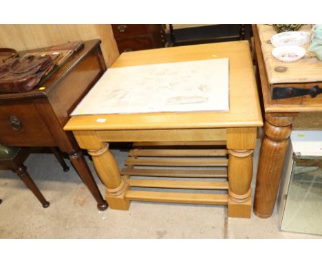 A light oak coffee table with under tier 