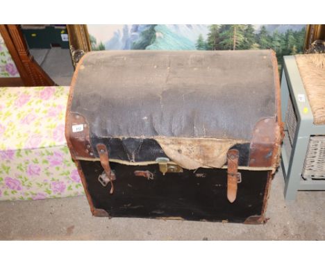 A leather and canvas mounted dome topped trunk  AF