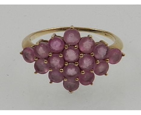 A 9 carat yellow gold and pink sapphire set ring of lozenge form. 