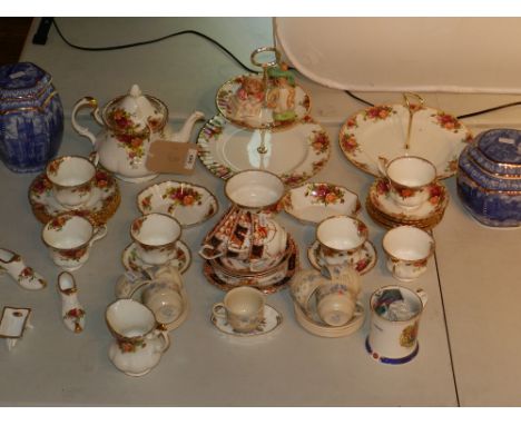 A Royal Albert Old Country Rose tea service, including teapot, and two tier serving plate, together with two Rington's tea ca