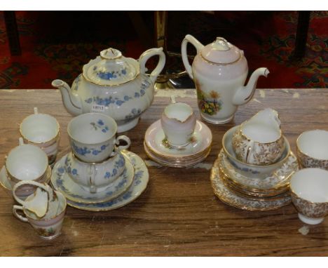 A part Sutherland coffee service decorated with gilt and  pink border and printed with flowers to centre, together with two p