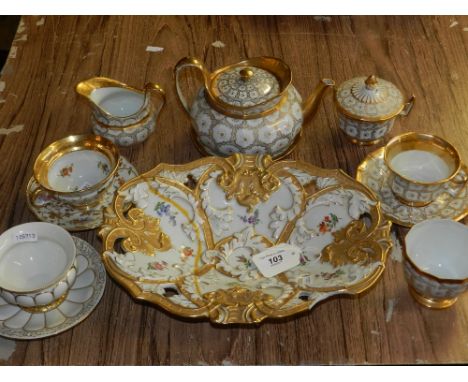 A Meissen porcelain bachelors tea set, decorated with gilt borders on a white ground, together with a large Meissen gilt deco