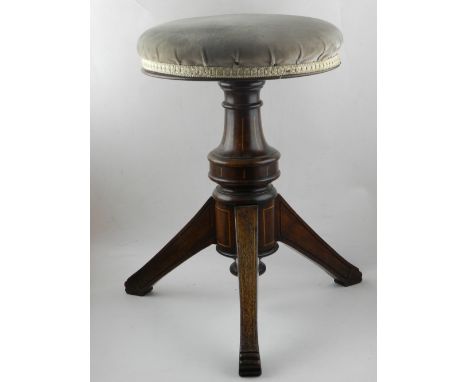 A late Victorian rosewood and inlaid piano stool, the circular seat above a baluster support and tripod base, on splayed squa