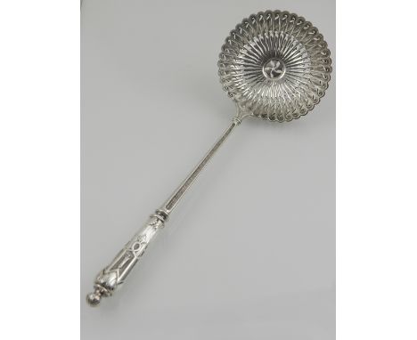 A Russian white metal pierced ladle, stamped 84 to handle, L.21cm