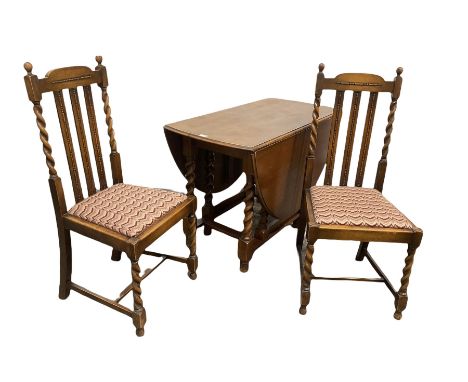 Early 20th century oak drop leaf table, the oval top raised on spiral turned supports with gate leg action, (W107cm) together
