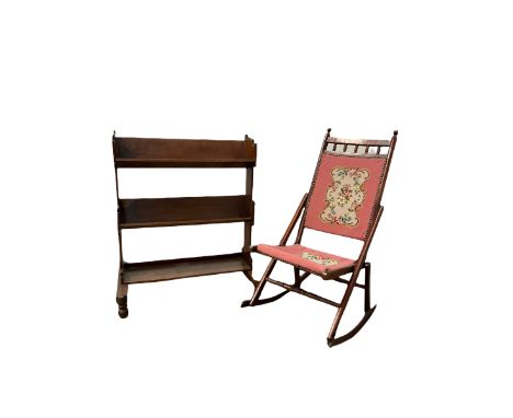 Edwardian mahogany floor standing bookcase, two book troughs over one open shelf, raised on shaped panel end supports with tu