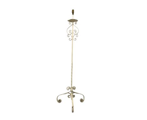 18th century style wrought iron lamp standard, with scrolled decoration and raised on three scrolled supports H140cm