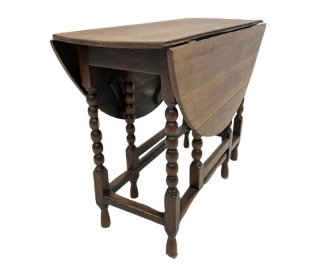 18th century and later oak gateleg table, the oval drop leaf top raised on bobbin turned and block supports united by stretch