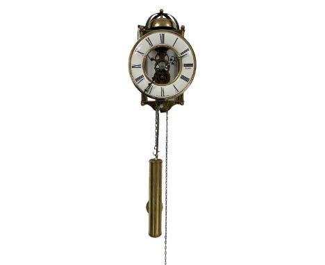 A German 20th century chain driven hanging wall clock with a visible skeletonised movement and 6� open dial, with Roman numer