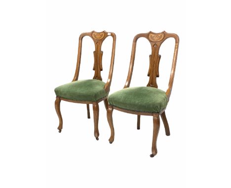 Pair of Art Nouveau period oak dining chairs, stylised floral inlay over a splat back, upholstered in overstuffed green fabri