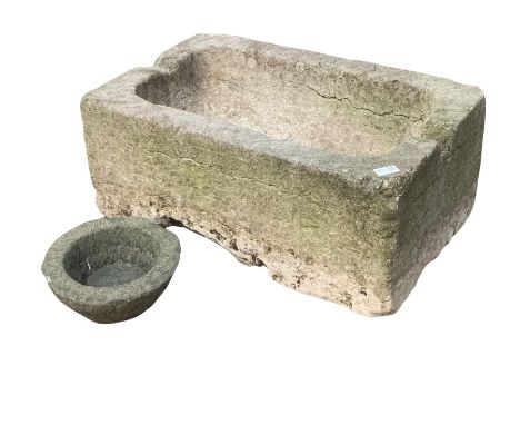 18th century limestone trough, having a sloped base and drainage hole, (W69cm) together with a small carved stone bowl plante