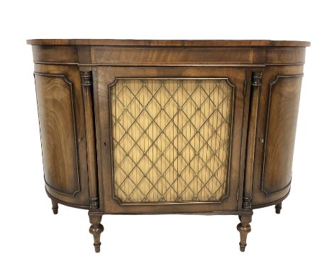 Regency style mahogany break bow front credenza sideboard, the top with rosewood cross band and boxwood string inlay, the cen