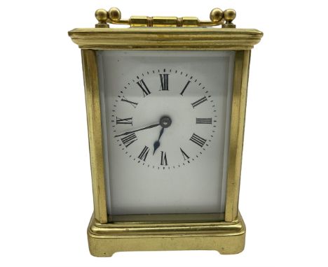 A late 19th century French Corniche carriage clock with four bevelled glass panels and a rectangular panel to the top, eight-