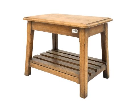 Vintage mid 20th century oak stool, the moulded top raised on square splayed supports united by a slatted magazine rack  unde