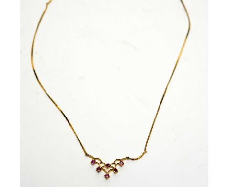 A 9ct yellow gold and ruby set necklace, the open-work pendant set with six circular facet cut rubies on a snake link chain, 