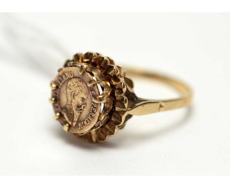 A yellow metal coin set ring, the coin bearing the bust of Emperor Maximilian, on 9ct yellow gold shank, ring size P, 3.6g gr