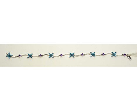 A topaz and amethyst set 9ct white gold bracelet, with floral and shaped links, 17.5cms long, 5.2g gross.