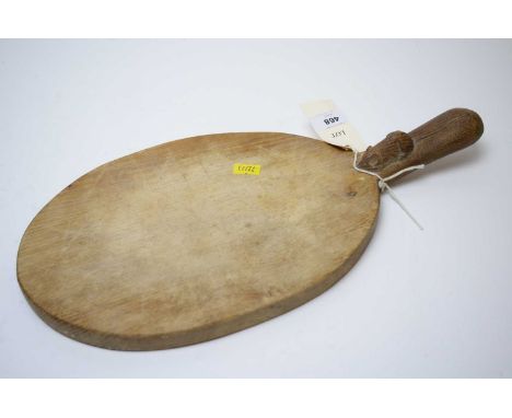 Robert 'Mouseman' Thompson carved oak cheeseboard, of oval form with carved mouse figure to handle, 39cms wide.
