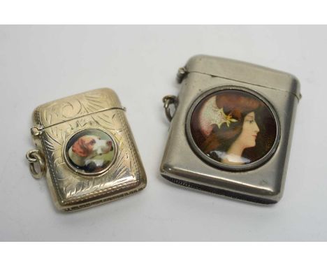 Two metal vesta cases with enamel cabochons, one depicting a female bust in Pre-Raphaelite style, the other with dogs head, s