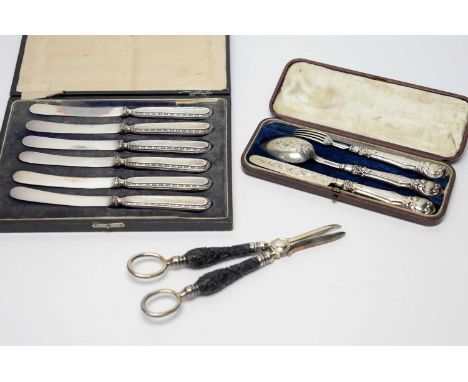 A silver knife and fork and spoon set, by George Unite, Birmingham 1846, with filled handles in fitted case; together with a 