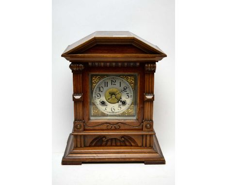 Early 20th Century mahogany mantel clock, the dial with applied scrolling gilt corners and silvered Arabic chapter ring, in a