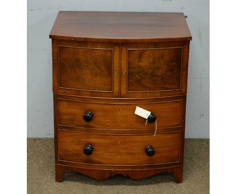 A 19th Century mahogany bowfront commode, with folding top and two dummy drawers below, 63 x 53 x 73cms (closed).