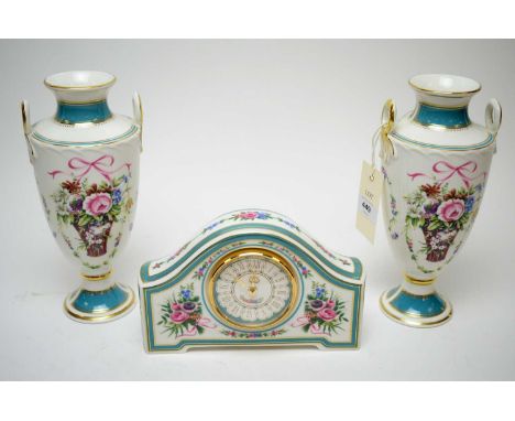 Minton 'Rose Basket' mantel clock; and a matched pair of Minton twin handled urn vases. (3)