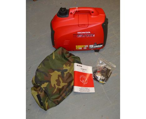 Honda EU10i Inverter suitcase generator, with accompanying owners manual and jerry cans of two-stroke.