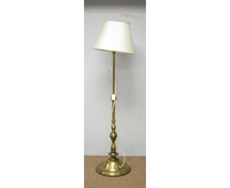 An Indian style gold painted metal lamp standard, with baluster stem and contemporary shade, 187cms high.