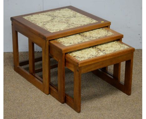 A nest of three mid Century teak and tile-topped occasional tables, the largest 56 x 51 x 44cms high.