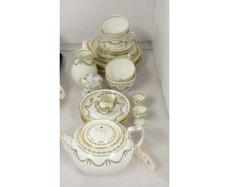 Hammersley T.Goode &amp; Co part tea and dinner service, decorated with foliate green and gilt swags, comprising tea pot, cre