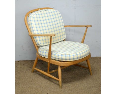 Ercol: a light beechwood Windsor style low armchair.