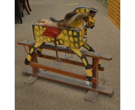 Vintage rocking horse, on stained wood base, 107cms long. 