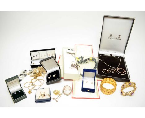 A selection of costume and other jewellery, including a cameo brooch; a gilt metal bangle; a selection of gilt metal chains a