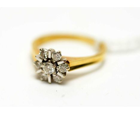 A diamond cluster ring, set with seven brilliant cut diamonds, on 18ct yellow gold shank, ring size M.