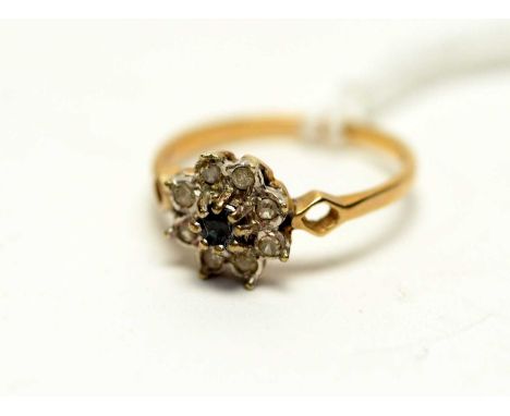 A sapphire and diamond cluster ring on 9ct yellow gold shank, ring size M.