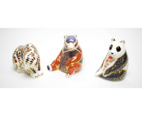 Royal Crown Derby 'Panda' paperweight; and two other Royal Crown Derby paperweights including a bear. (3) 