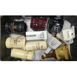 A collection of Wade water jugs and decanters to include Bell's decanters, White Whyte, Mackay,