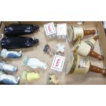 A mixed collection of wade to include Bell's Whiskey decanters, Sandy man, penguins, cockatoo,