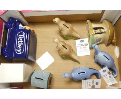 A collection of Wade Novelty Money Boxes to include Tyrannosaurus, Thomas The Tank Engine, Mushroom Pixie House and Tetley Te