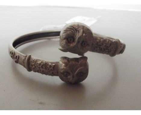 800 grade silver bangle, the ends depicting owl's faces 