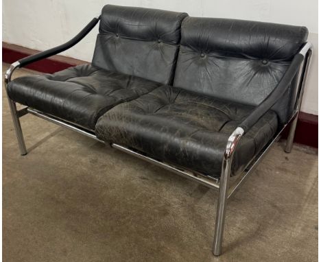 A Pieff chrome and black leather two seater settee 