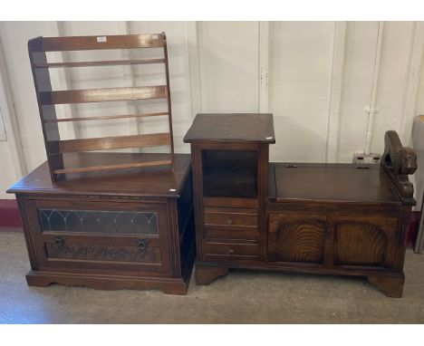 An oak telephone seat, a carved oak media cupboard, a copper topped coffee table and one other