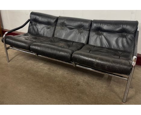 A Pieff chrome and black leather three seater settee 