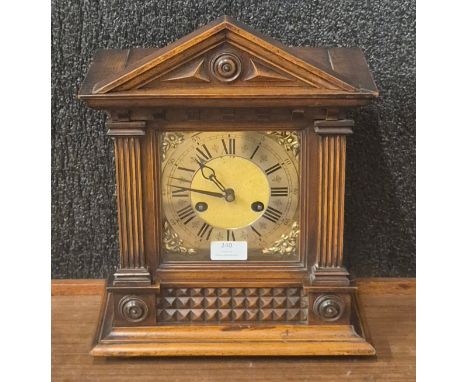 A late 19th Century German 8-day beech architectural cased mantel clock 
