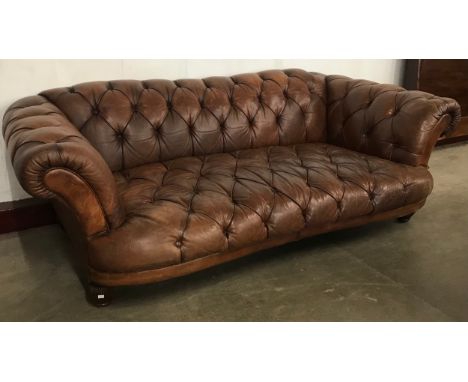 A Regency style brown leather Chesterfield settee 
