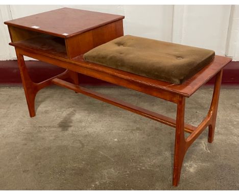 A teak telephone seat 