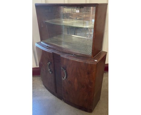 An Art Deco walnut cocktail cabinet 